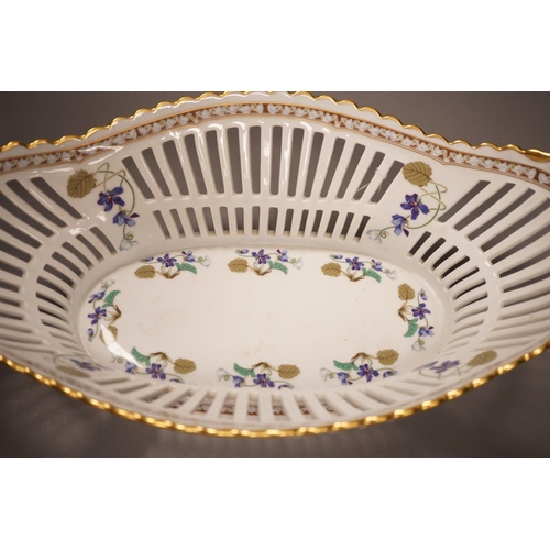 1319 - A Haviland Limoges fruit basket, painted with trailing flowers, 41cm