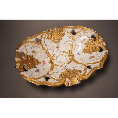 1329 - An early 20th century Meissen two handled white and gilt floral oval dish, 32cm