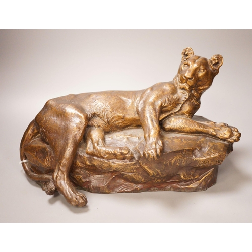 1345 - After Charles Valton, a gilt bronze study of a recumbent lioness, 39cm