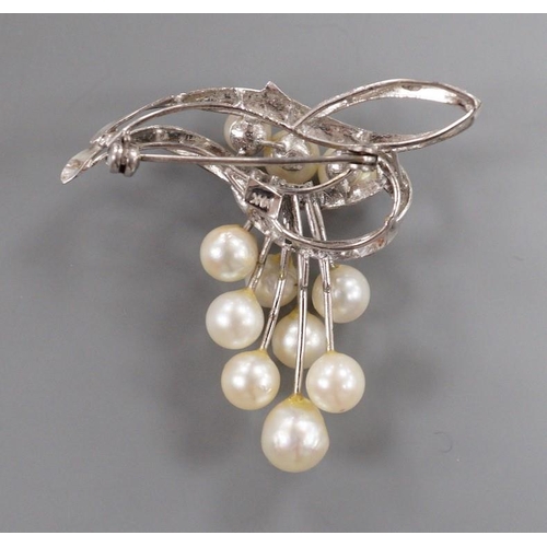 1882 - A modern 14k and graduated eleven stone cultured pearl cluster set brooch, 40mm, gross weight 7.4 gr... 