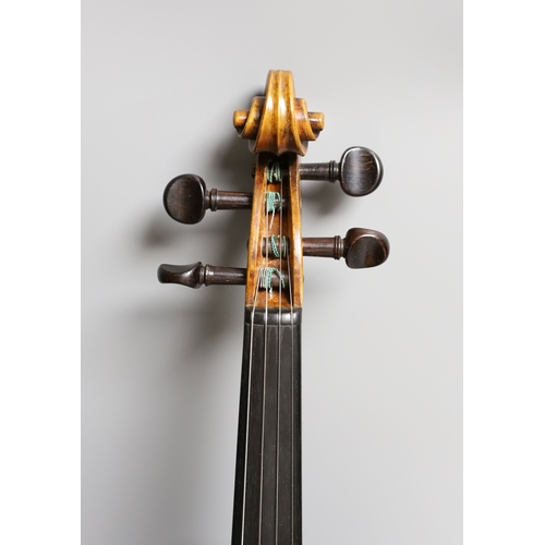 1283 - A 19th century violin labelled JB Guadagnini, back measures 35cm, with two bows, one silver-mounted.... 