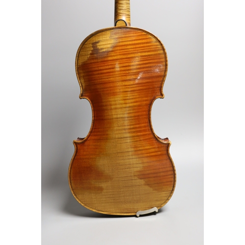 1283 - A 19th century violin labelled JB Guadagnini, back measures 35cm, with two bows, one silver-mounted.... 