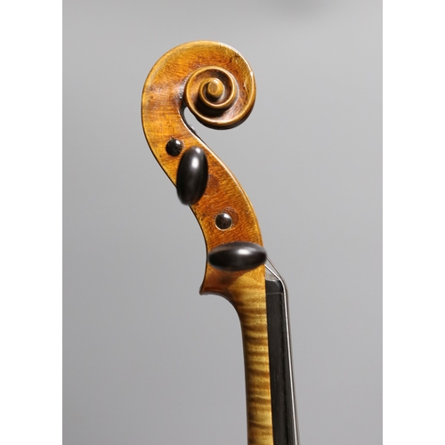 1283 - A 19th century violin labelled JB Guadagnini, back measures 35cm, with two bows, one silver-mounted.... 