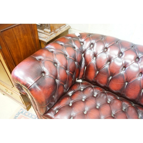 1 - A Victorian style buttoned burgundy leather Chesterfield settee, length 200cm, width 90cm, height 74... 