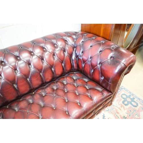 1 - A Victorian style buttoned burgundy leather Chesterfield settee, length 200cm, width 90cm, height 74... 