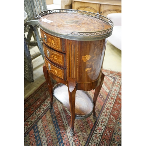 113 - An early 20th century French marquetry oval three drawer small chest, width 50cm, depth 36cm, height... 