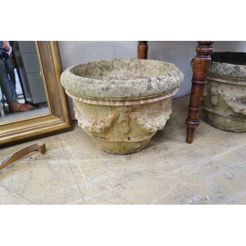 130 - A pair of circular reconstituted stone garden urns with swagged floral bodies diameter 46cm height 3... 