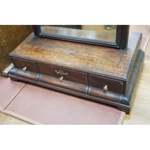 161 - An 18th century mahogany box based toilet mirror, with bevelled plate and three base drawers, on bra... 