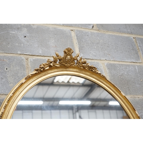 20 - An early 20th century gilt wood and gesso oval wall mirror width 75cm height 96cm.