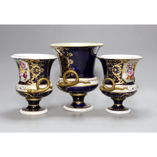 255 - A garniture of three early 19th century floral painted Derby vases, tallest 20cm