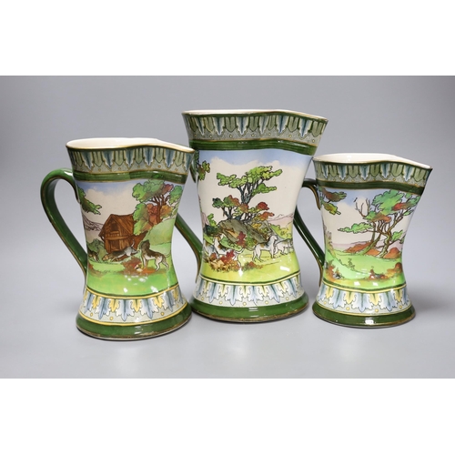 265 - A graduated set of three Royal Doulton hunting jugs, 22cm