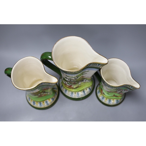 265 - A graduated set of three Royal Doulton hunting jugs, 22cm