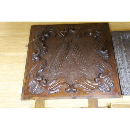 284 - Three assorted cast metal panels together with a carved walnut panel, 39x40cm