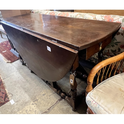 37 - An early 18th century style oak oval topped gateleg dining table, (one leaf in need of repair), leng... 