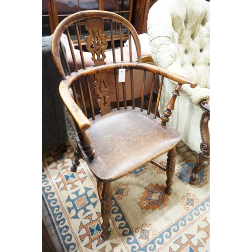 41 - A mid 19th century Yorkshire area Windsor yew and elm elbow chair with crinoline stretcher, width 59... 