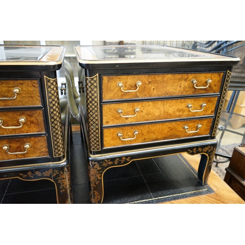 54 - A pair of Drexel chinoiserie decorated, ebonised and pollard oak three drawer tables with glass tops... 