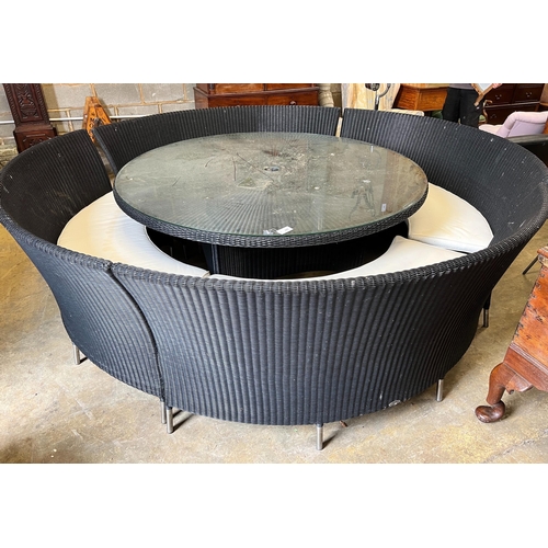 64 - A large Westminster black all weather rattan circular topped garden table, diameter 180cm, height 74... 