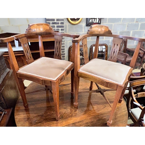 65 - A pair of Edwardian inlaid mahogany corner elbow chairs