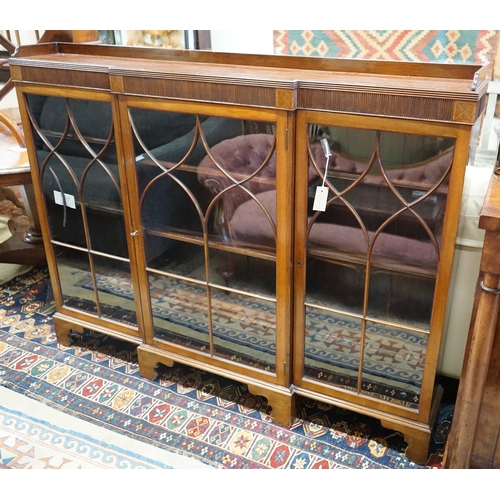 80 - A 1920's Chippendale revival mahogany breakfront bookcase, length 154cm, depth 22cm, height 120cm... 