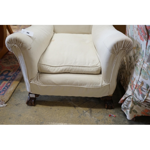 88 - A 1920's upholstered mahogany club armchair on ball and claw feet, width 74cm, depth 86cm, height 75... 