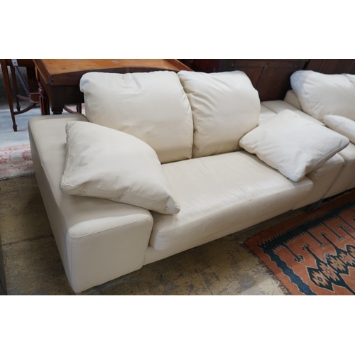 93 - A contemporary Italian design cream leather three seater and two seater settee, larger length  210cm... 