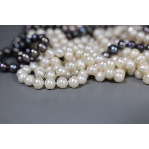 976 - Thirteen assorted modern freshwater pearl necklaces, longest 116cm.