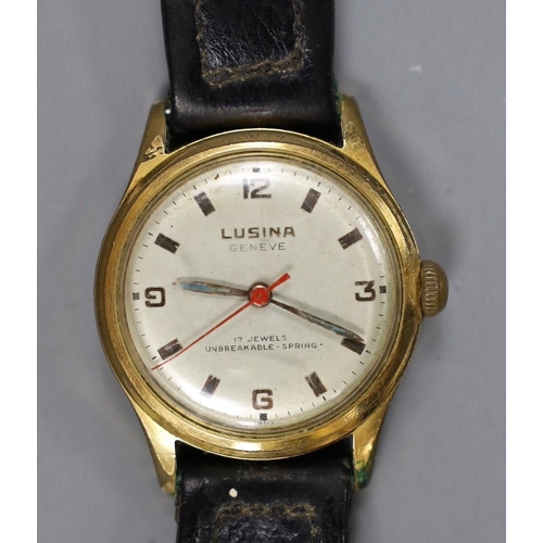 977 - A steel and gold plated boy's size Lusina manual wind wrist watch, on leather strap.