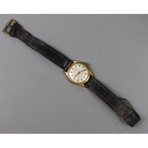 977 - A steel and gold plated boy's size Lusina manual wind wrist watch, on leather strap.