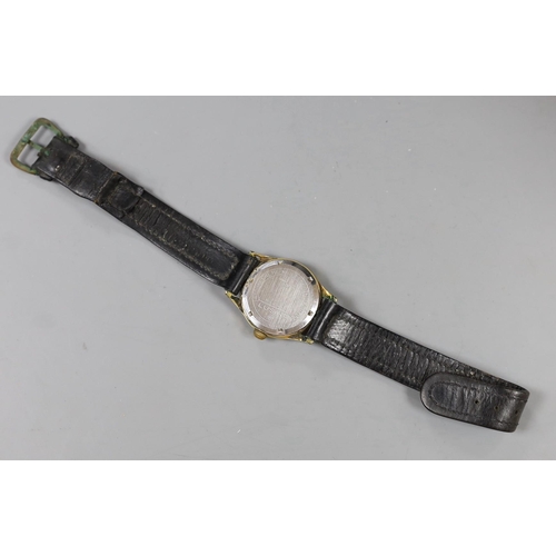 977 - A steel and gold plated boy's size Lusina manual wind wrist watch, on leather strap.