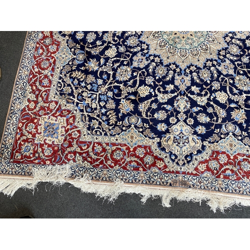 197 - A North West Persian blue ground part silk rug, 220 x 217cm together with a similar smaller red grou... 