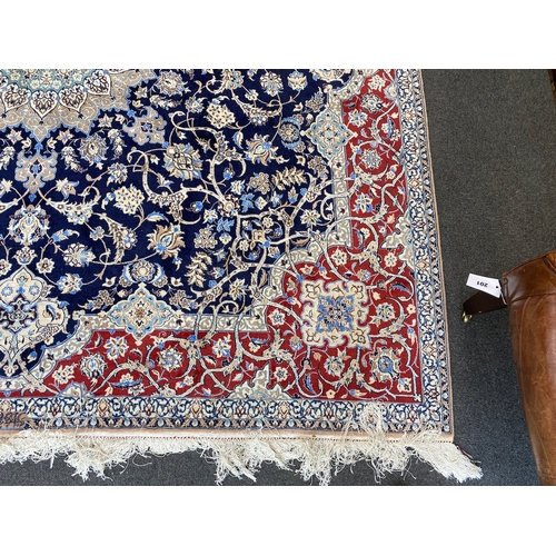 197 - A North West Persian blue ground part silk rug, 220 x 217cm together with a similar smaller red grou... 