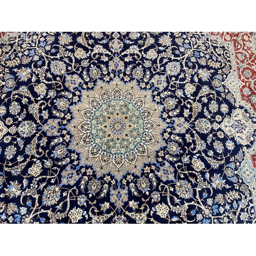 197 - A North West Persian blue ground part silk rug, 220 x 217cm together with a similar smaller red grou... 