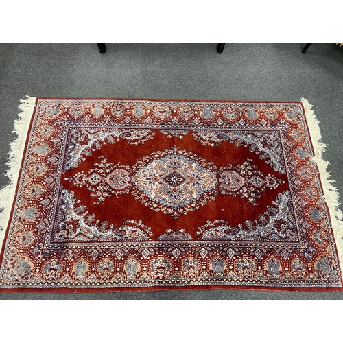 197 - A North West Persian blue ground part silk rug, 220 x 217cm together with a similar smaller red grou... 