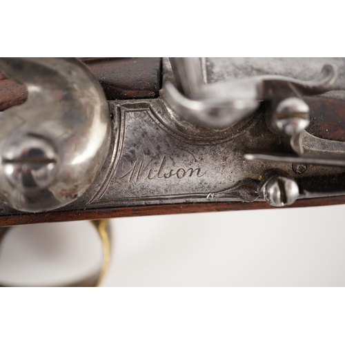 10 - Wilson of London. An early 18th century flintlock pocket pistol, with screw-off barrel and brass mou... 