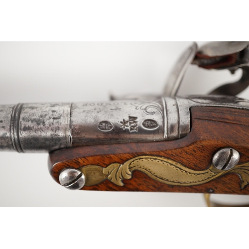 10 - Wilson of London. An early 18th century flintlock pocket pistol, with screw-off barrel and brass mou... 