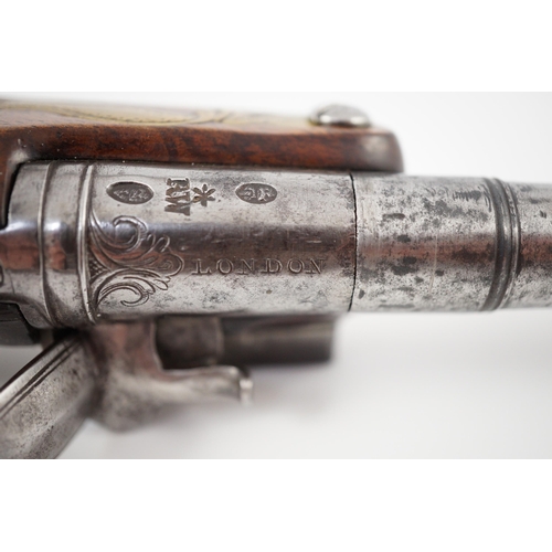 10 - Wilson of London. An early 18th century flintlock pocket pistol, with screw-off barrel and brass mou... 