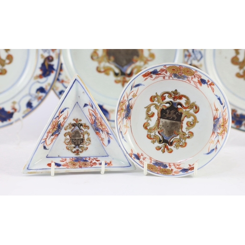 102 - A Chinese export armorial part dinner and tea service, Kangxi period, c.1720, each piece painted in ... 