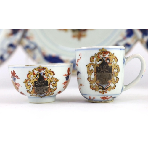 102 - A Chinese export armorial part dinner and tea service, Kangxi period, c.1720, each piece painted in ... 