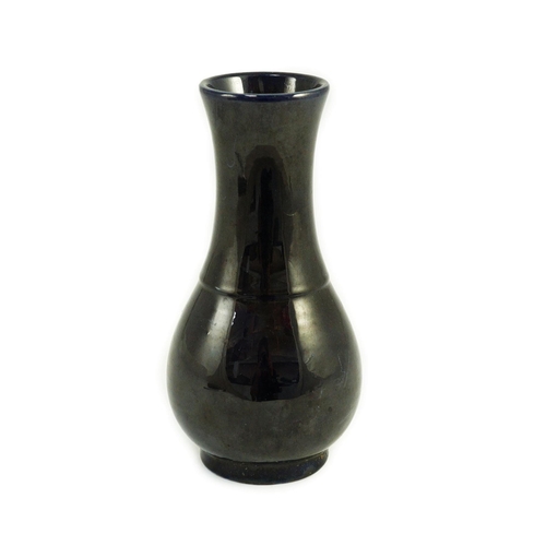 103 - A small Chinese aubergine glazed vase, 18th century, of baluster form, unglazed base, 16.4cm high... 