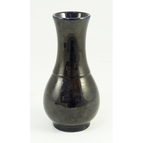 103 - A small Chinese aubergine glazed vase, 18th century, of baluster form, unglazed base, 16.4cm high... 