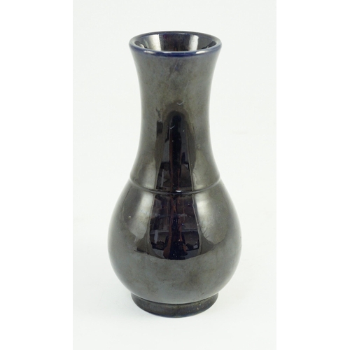 103 - A small Chinese aubergine glazed vase, 18th century, of baluster form, unglazed base, 16.4cm high... 