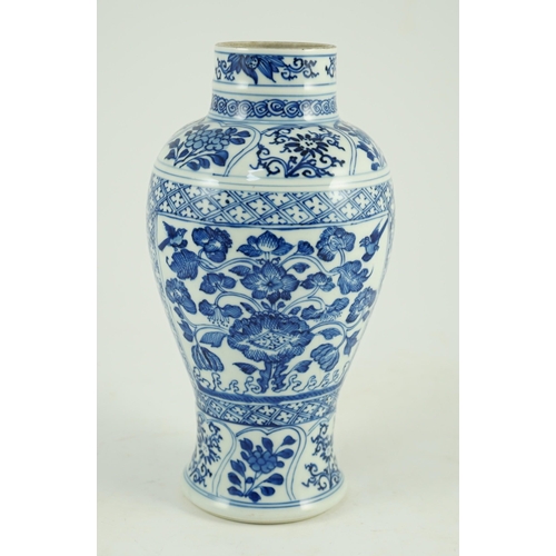 105 - A Chinese blue and white vase, Kangxi period, painted with birds amid flowers and rockwork, within f... 