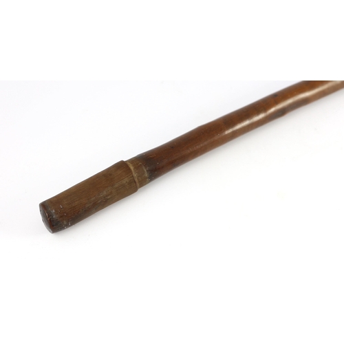 11 - A South Sea Island hardwood war club, with chevron banded engraving beneath the head and unpolished ... 