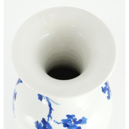 115 - A tall Chinese blue and white ladies vase, laifu zun, 19th century, painted with ladies in a fenced ... 