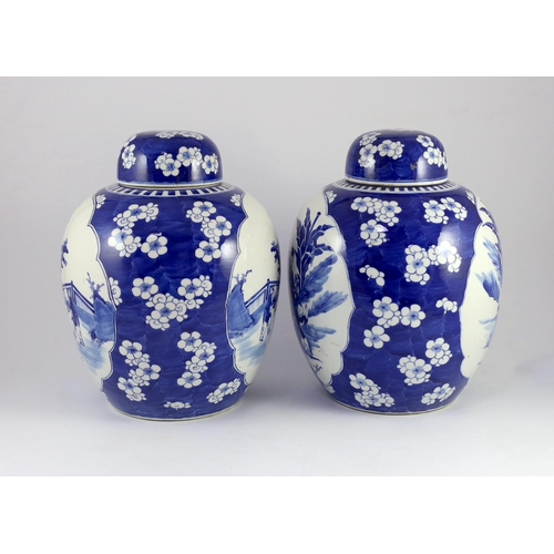 122 - A pair of large Chinese blue and white jars and covers, 19th century, painted to each side with a la... 