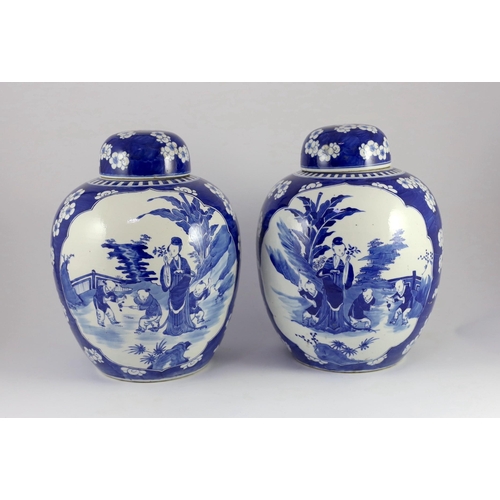 122 - A pair of large Chinese blue and white jars and covers, 19th century, painted to each side with a la... 