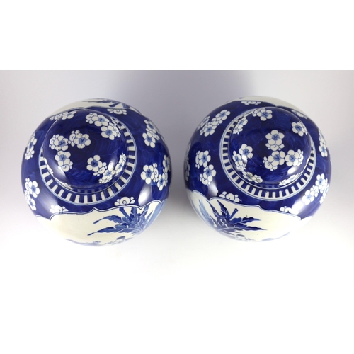 122 - A pair of large Chinese blue and white jars and covers, 19th century, painted to each side with a la... 