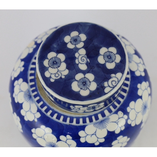 124 - A Chinese blue and white prunus jar and cover, 19th century, of ovoid form, double circle mark to ba... 