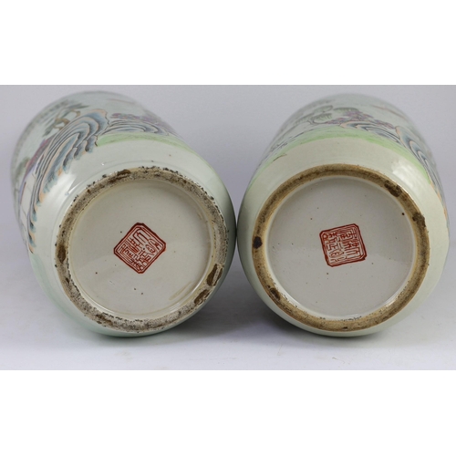 128 - A pair of Chinese famille rose fencai inscribed vases, mid 19th century, each well painted with scho... 