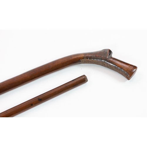 13 - Two Tongan hardwood war clubs, one with curved tip to the head, the other of plain tapered form, 87c... 